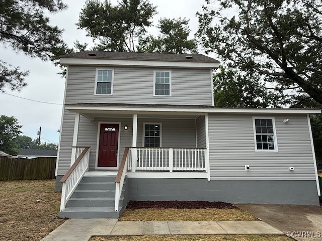 Traditional home featuring a porch