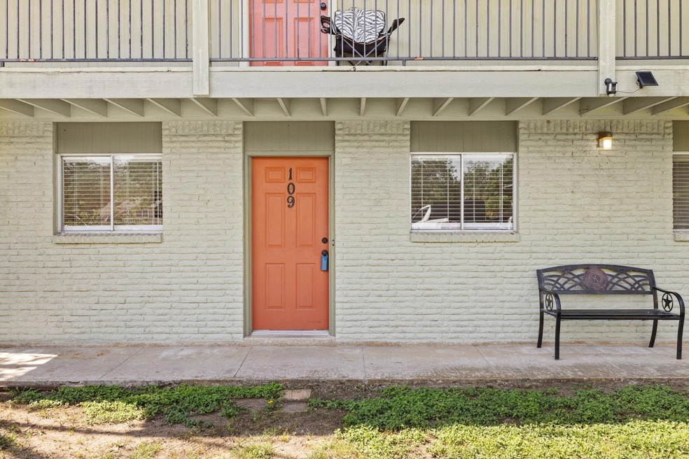View of exterior entry with a balcony and brick s