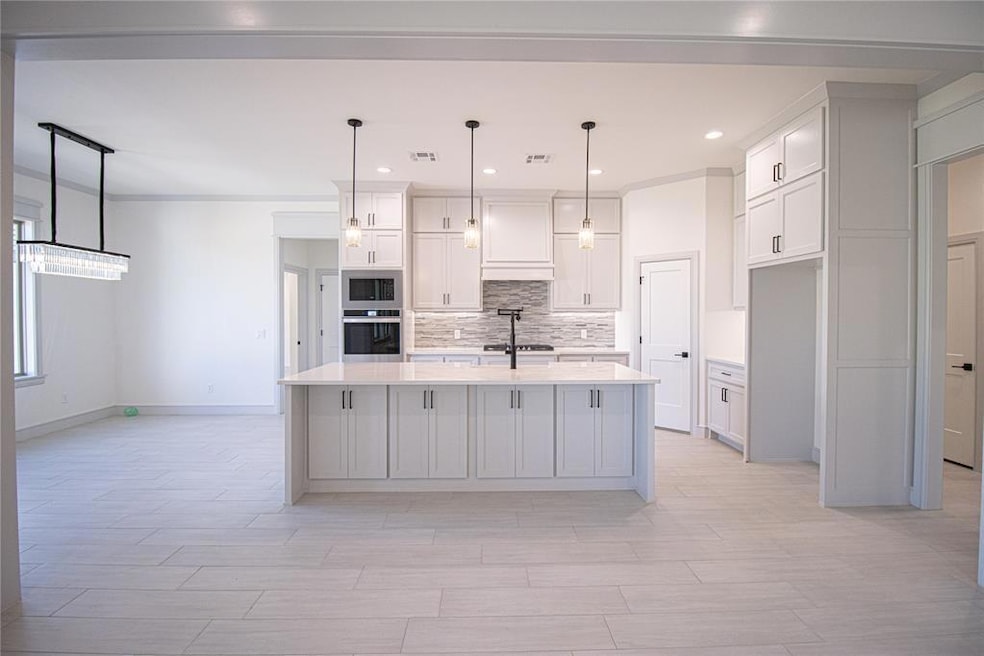 Kitchen with built in microwave, stainless steel o