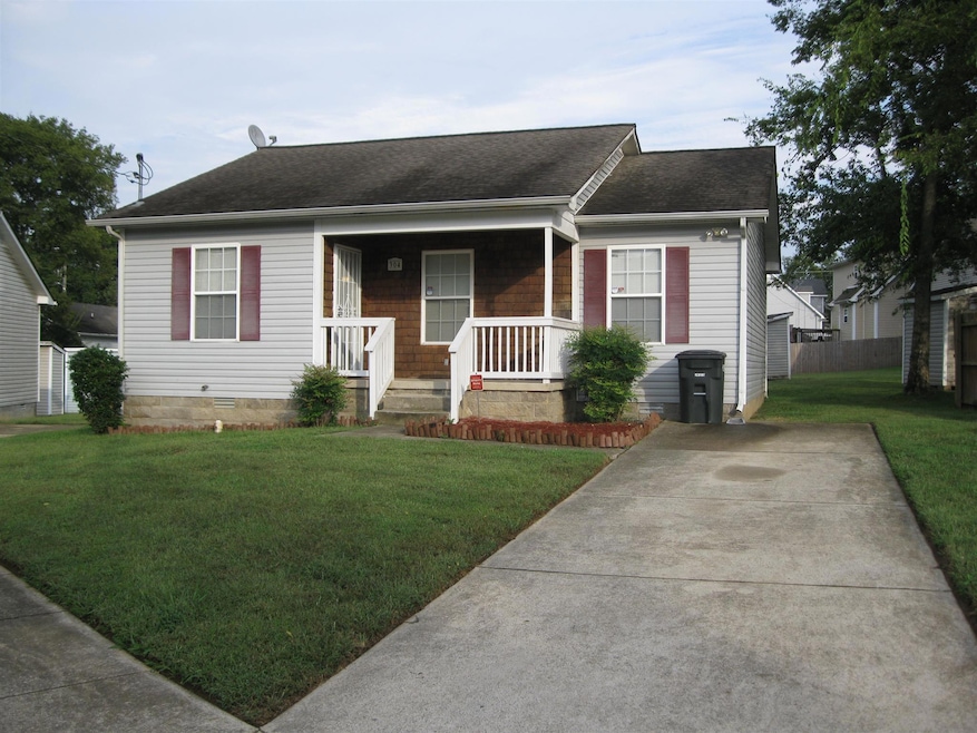 Adorable home with nice rocking chair front porch and large level front yard!