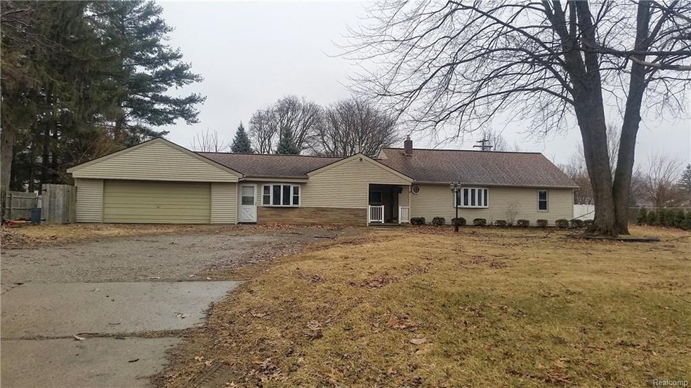 Livonia ranch on .63 acres