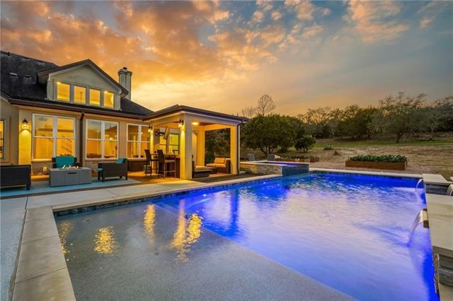 What a serene setting! Enjoy this 26,000 gallon pool + heated spa sitting on over 1 acre in the highly sought after neighborhood OVERLOOK AT LEWIS MOUNTAIN in Southwest Austin.