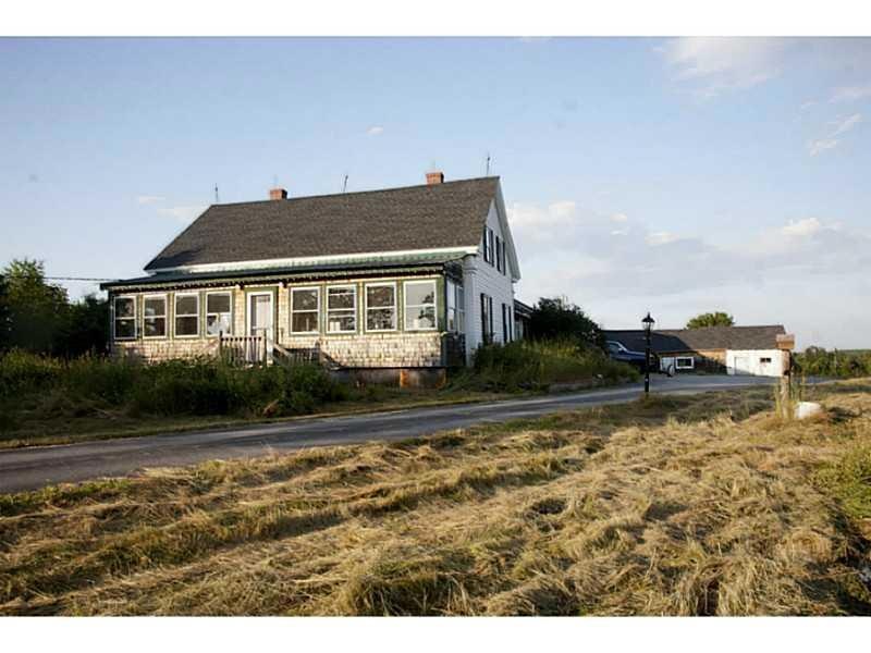 Exterior Front. High atop a hill in...