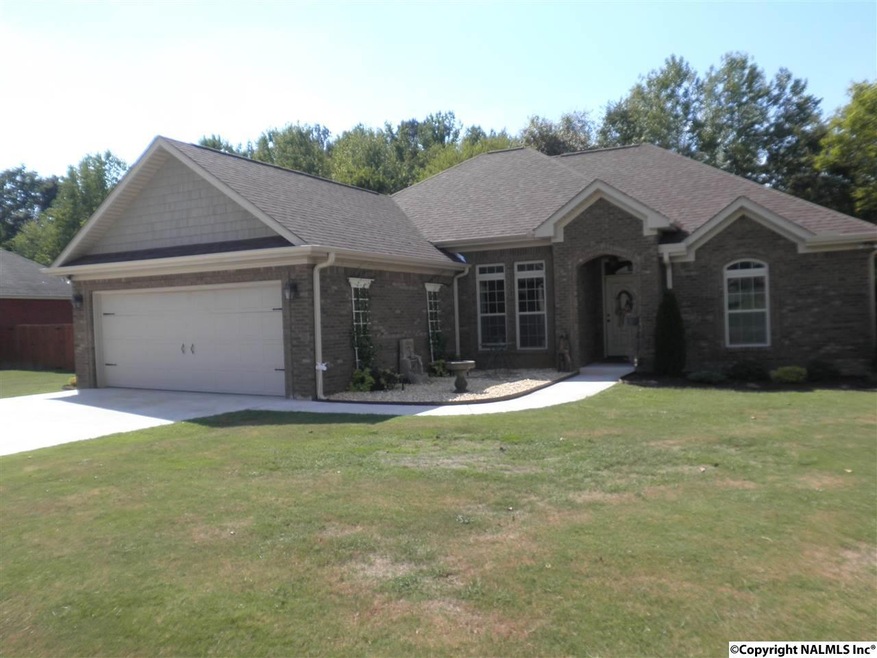 This inviting home sits on a large lot. There is a tree line to the west for privacy and shade.
