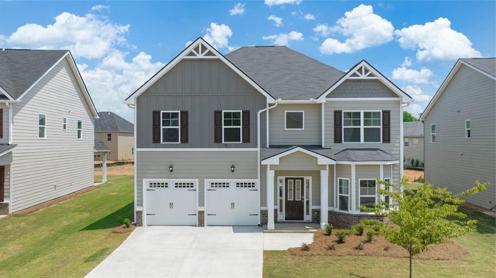 View of front of home featuring a garage and a fro