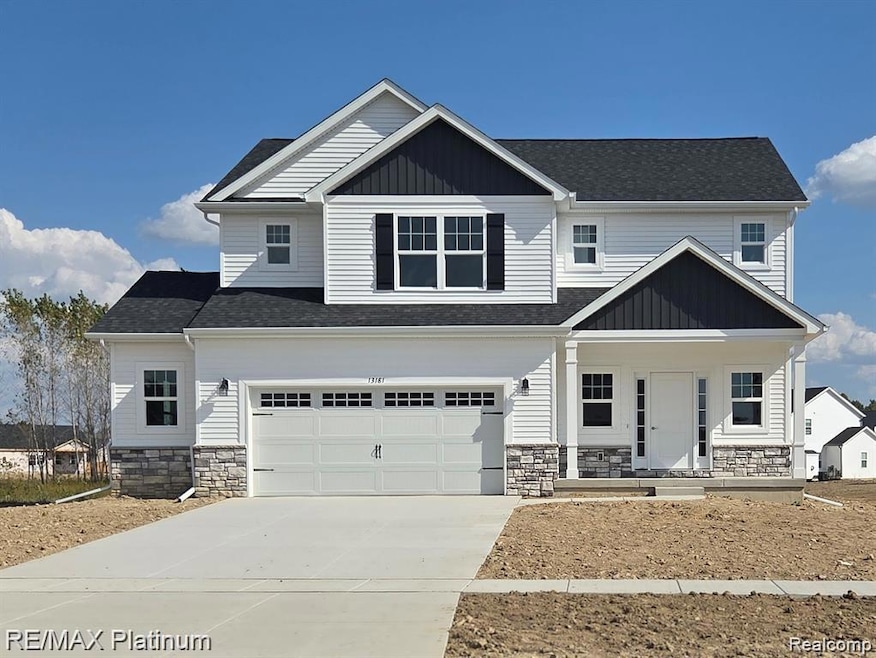 Craftsman inspired home with stone siding, a porch, concrete driveway, and a garage