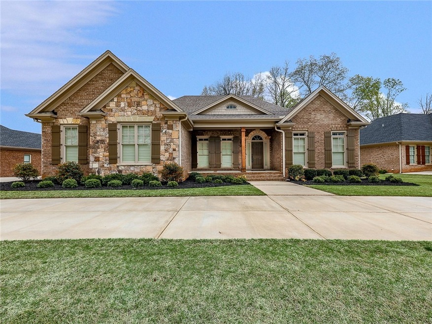Beautiful 4 side brick ranch with stone accents