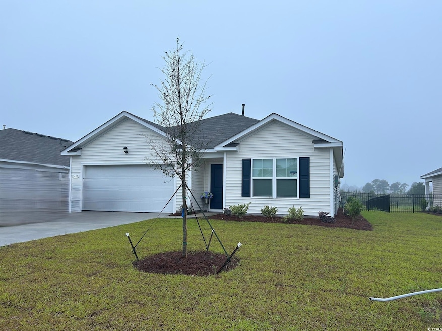 Ranch-style home with an attached garage and concrete driveway