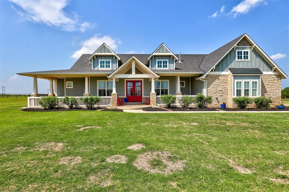 Craftsman-style home with covered porch and a fron