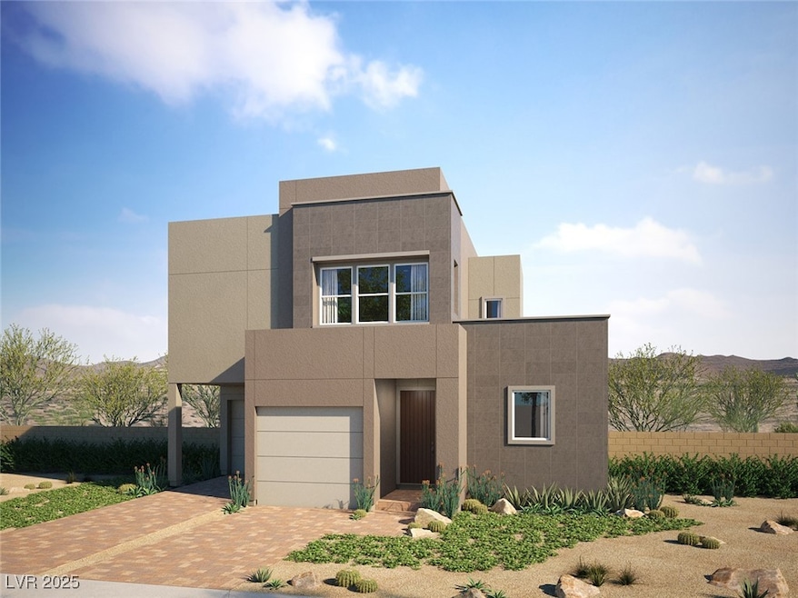 View of front facade with decorative driveway, an