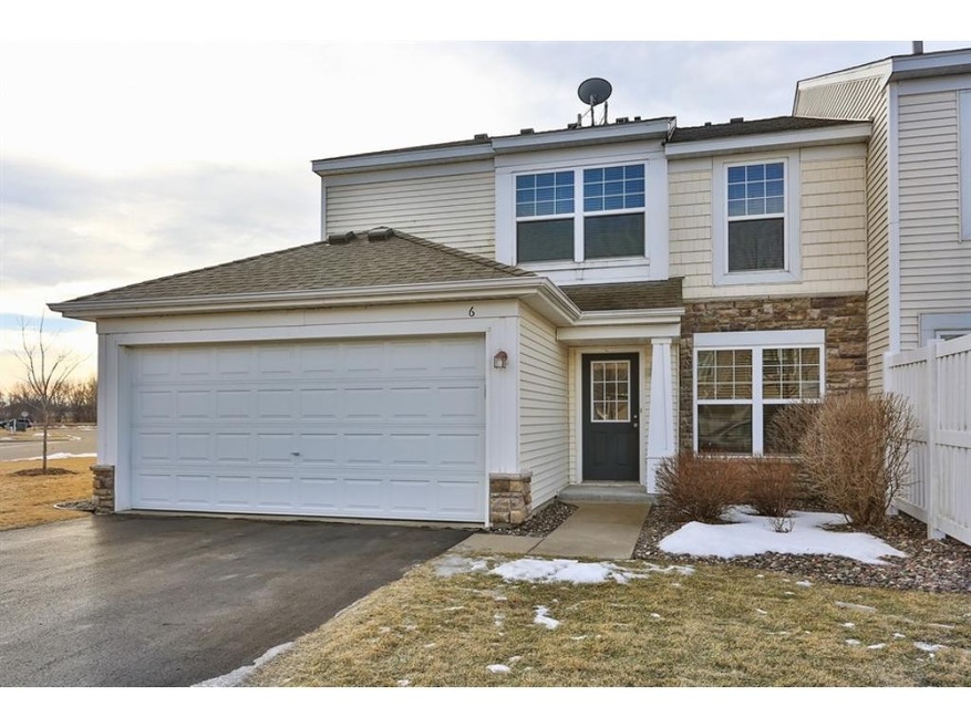 End unit with great side yard.