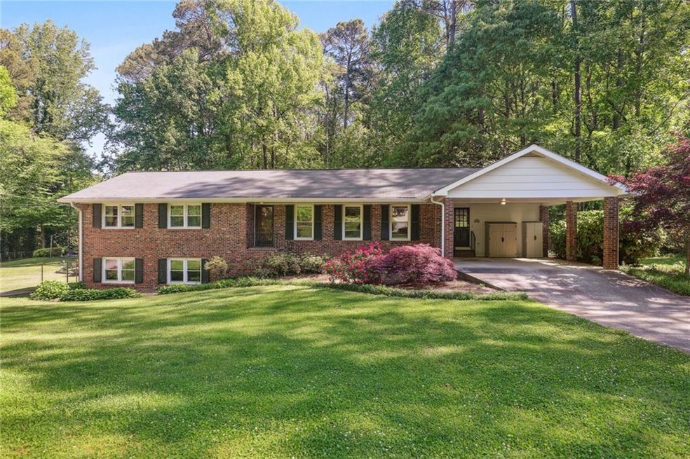 View of front of property featuring a carport and 