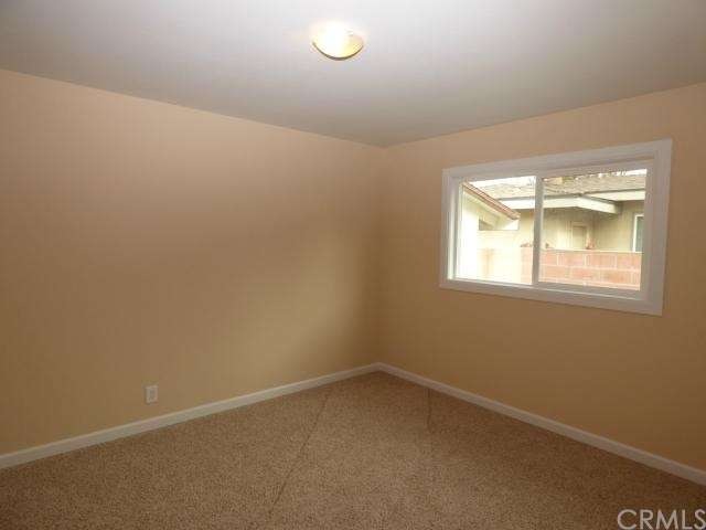 Bedroom Two w/ New Carpeting.  New Designer Paint. New Double Pane Windows. New Baseboards. New Light.  Scraped Ceiling w/ Orange Peel Texture.