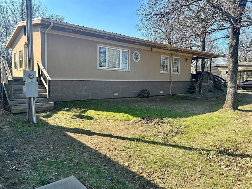 View of side of home featuring crawl space and a y