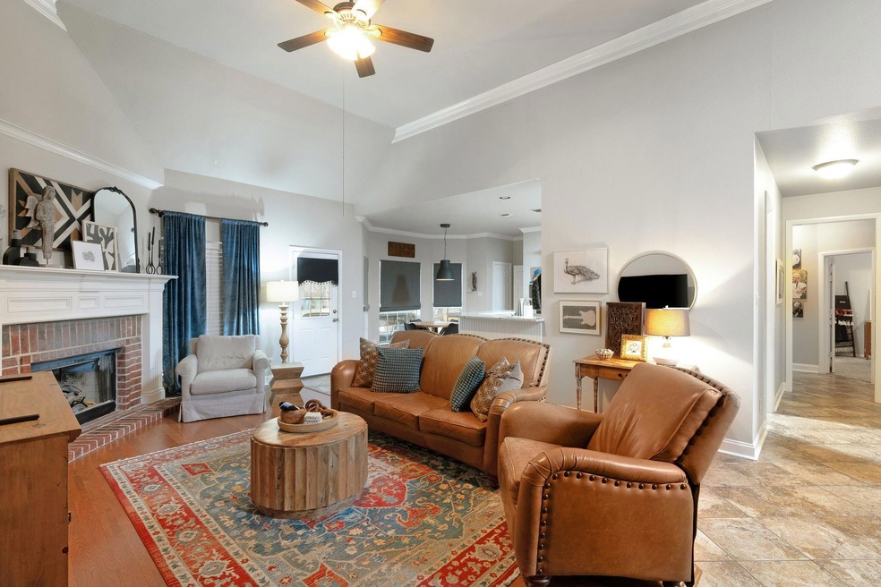 Living room with a brick fireplace, ornamental mol