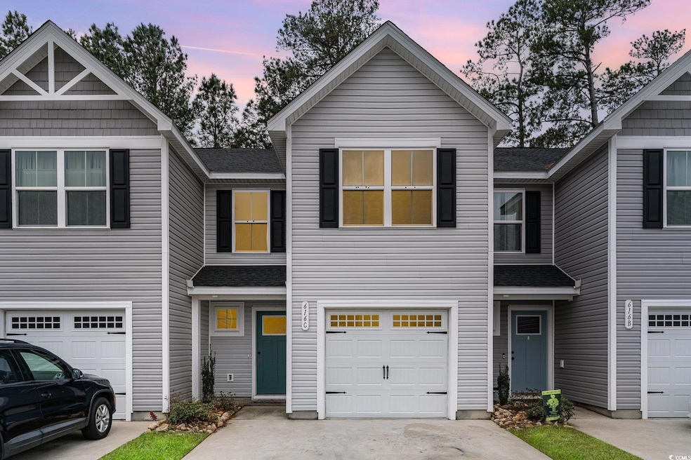 Townhome / multi-family property featuring a shing