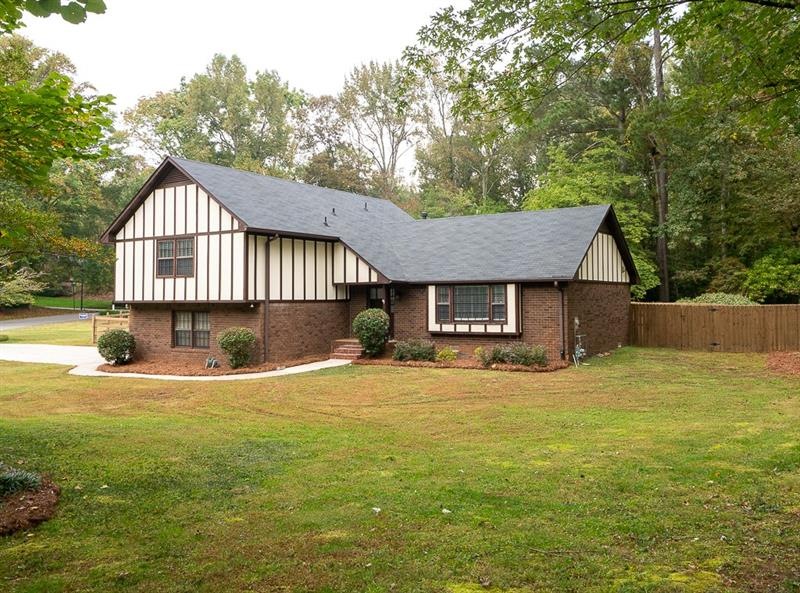 Well maintained tudor style split level on a huge 