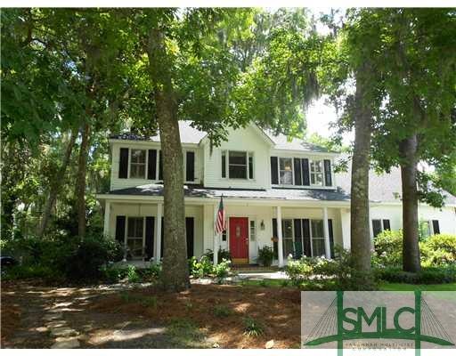 Exterior Front. FRONT OF THE HOUSE WITH MATURE TRE