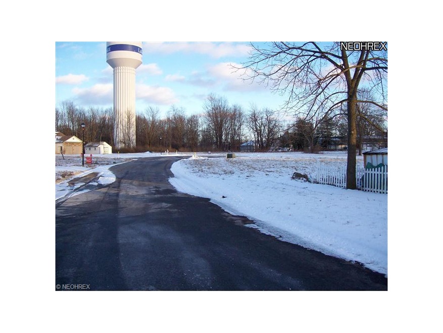 A view looking down the street.  Home site is to t