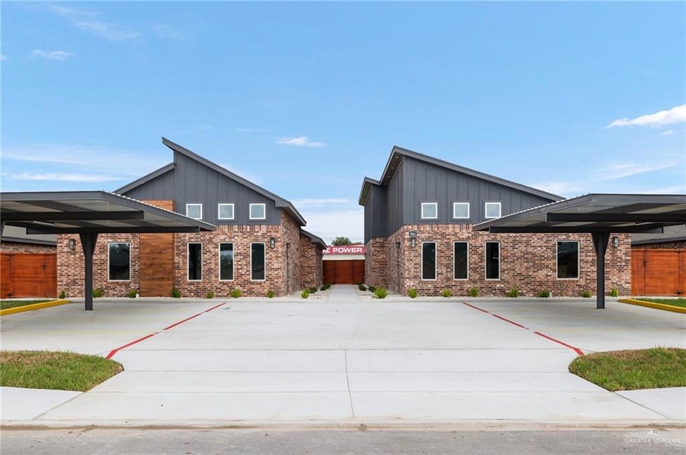 View of front of house with a carport