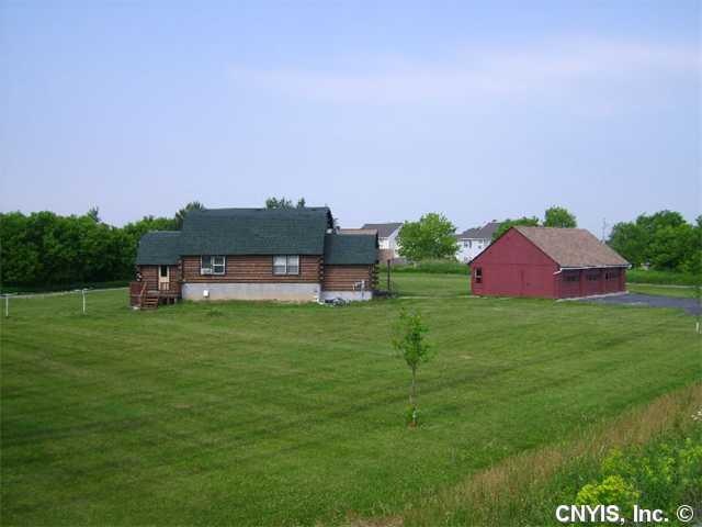 Exterior Front. Log home and garage on 1.8 acres. 