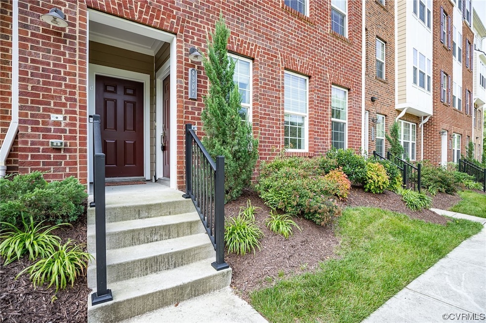 View of exterior entry with a yard
