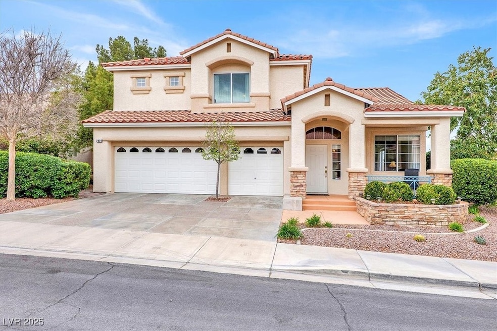 Mediterranean / spanish house with driveway, stone