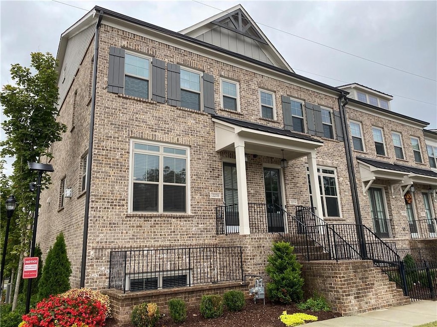 View of front of house featuring brick siding and 
