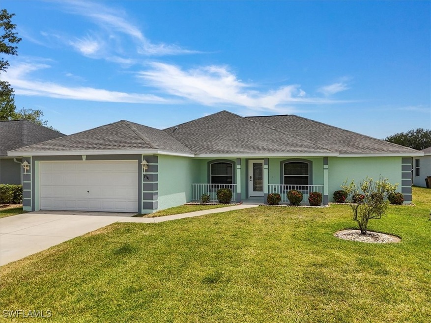 Ranch-style house featuring a front lawn, a porch,