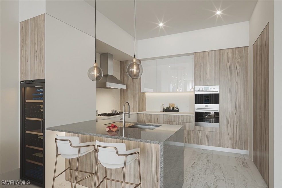Kitchen with dark stone countertops, sink, wall ch