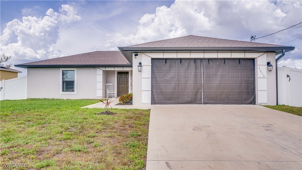 Ranch-style home with stucco siding, driveway, an