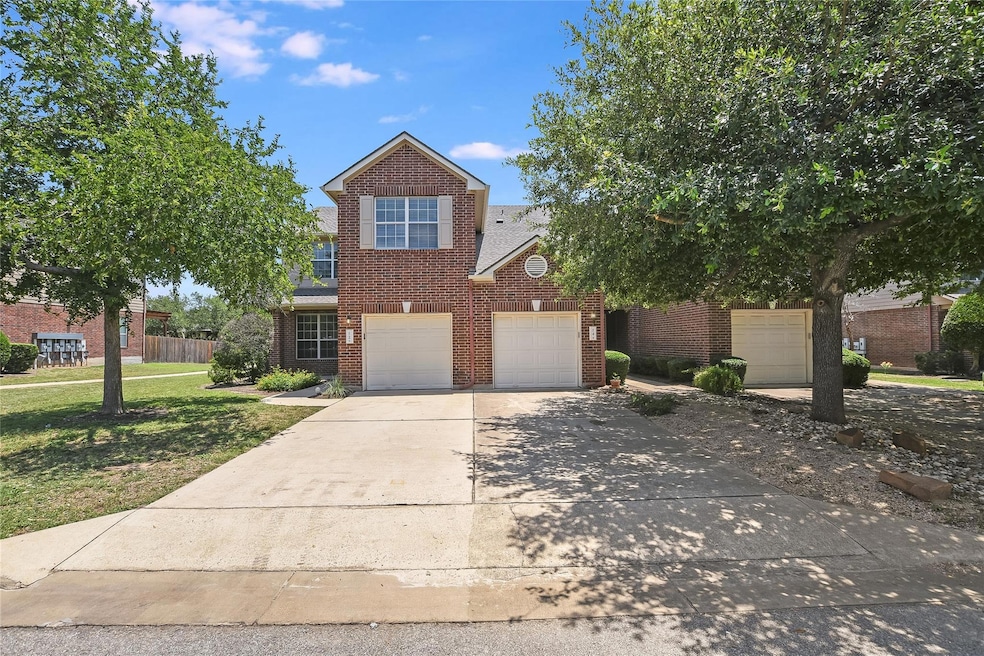 Traditional-style house featuring brick siding, c