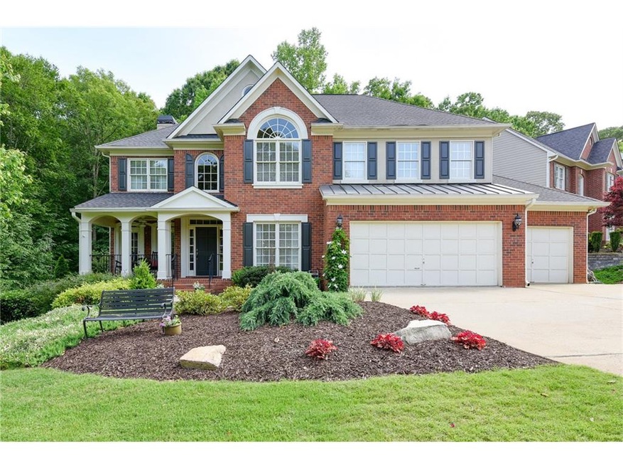 Stately brick two story home with rare THREE CAR G