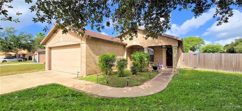 Ranch-style house with concrete driveway, brick siding, and a garage