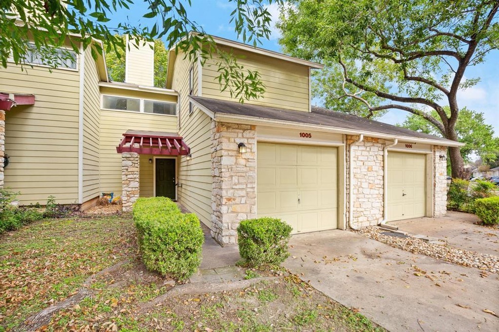 Mid-century inspired home with concrete driveway,