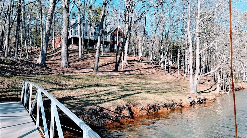 This is a pic of the home and property taken from the lower level of the dock in March 2025