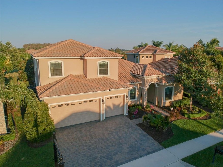 Late afternoon front view  aerial view of home. Be