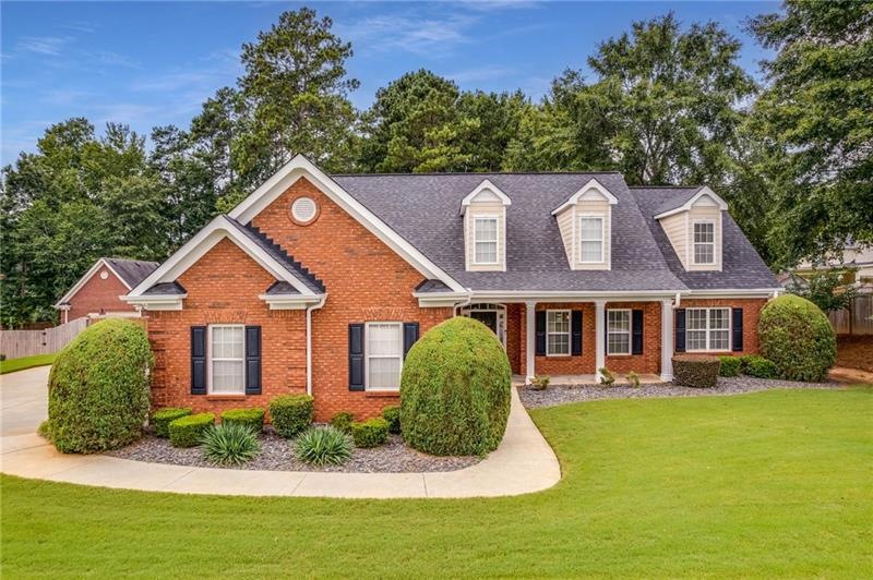 Gorgeous three-sided brick home in mint condition.