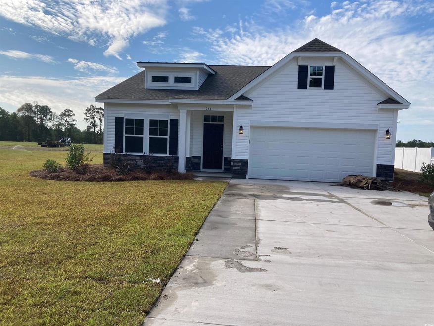 View of front of property with a front lawn