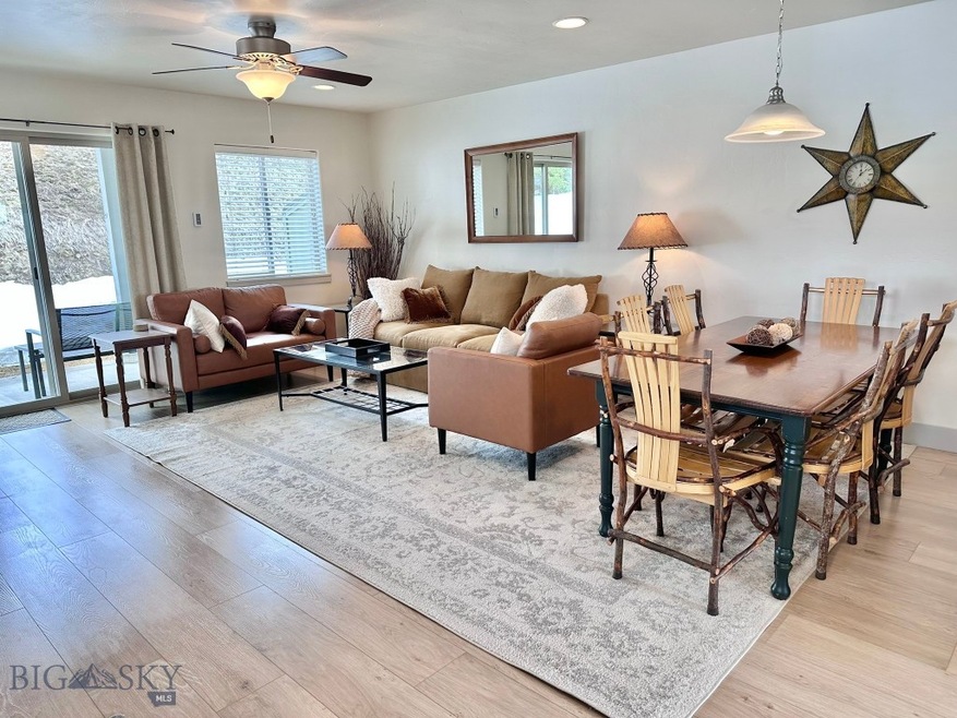 Living and dining area from front entrance of cond