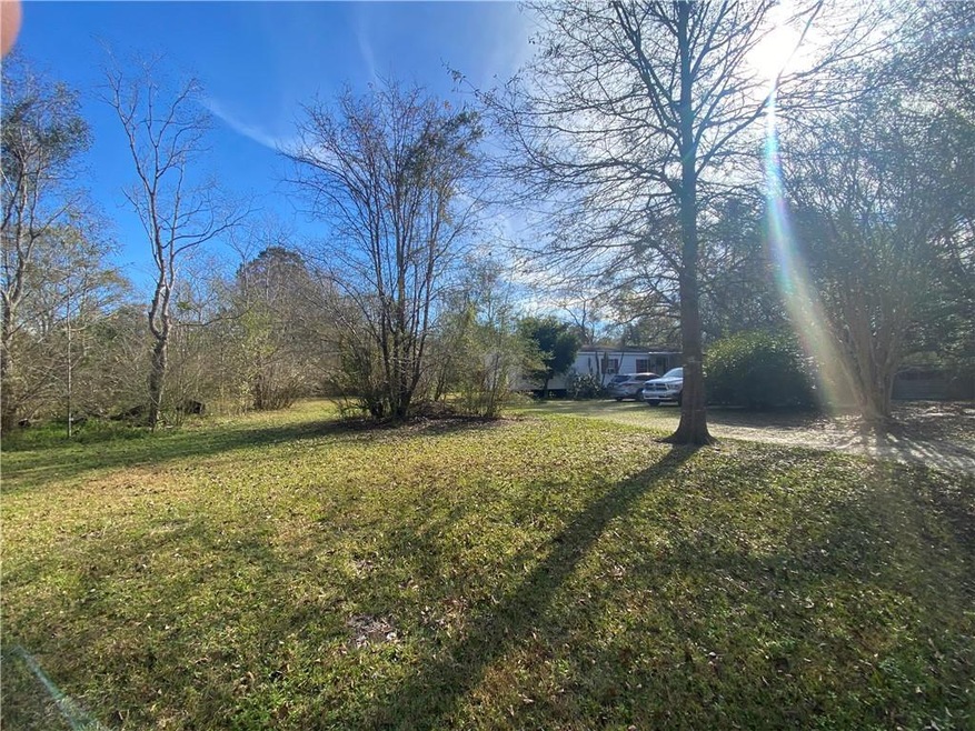 .77 Acres. Trailer will not remain on property.