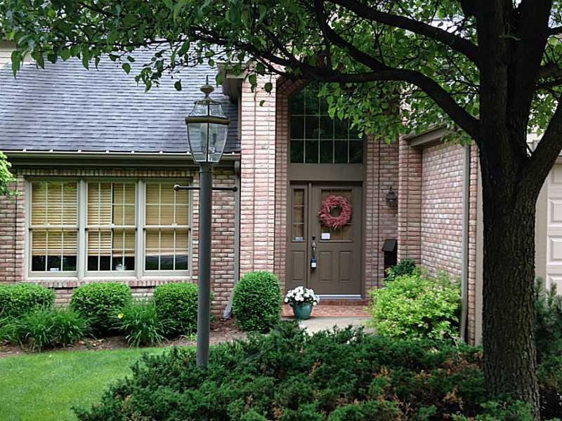 Exterior Front. Maintenance free landscaped yard