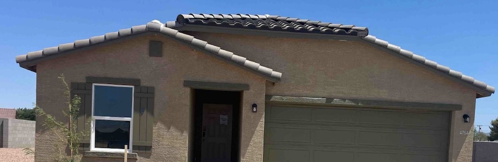 View of front of home featuring a tile roof and st