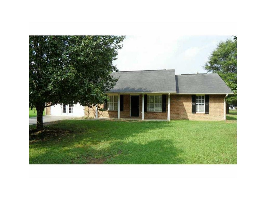 Exterior Front. Brick ranch in country setting