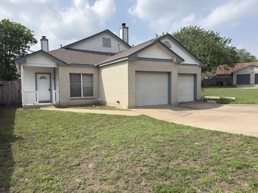 Ranch-style home with roof with shingles, an atta