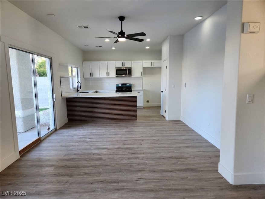Kitchen with light hardwood / wood-style flooring,