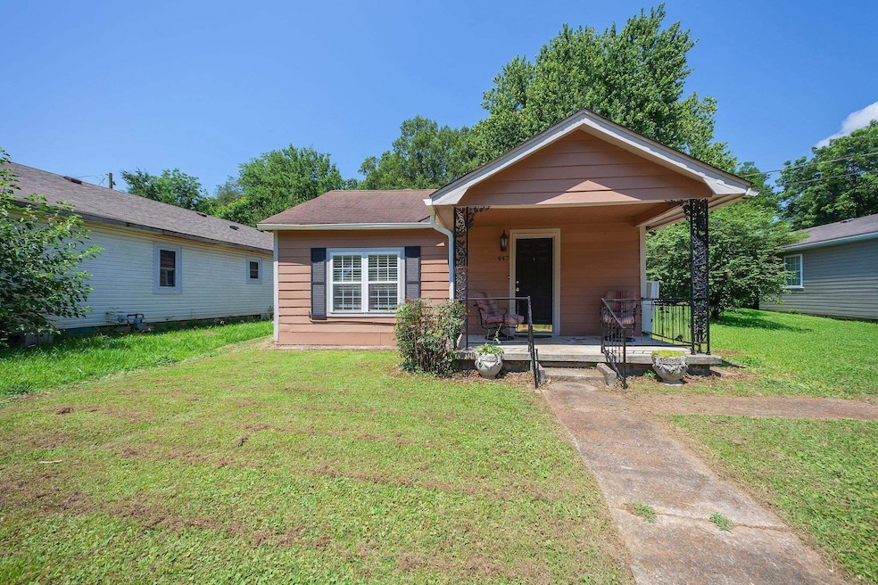Bungalow-style house with a porch and a front yard