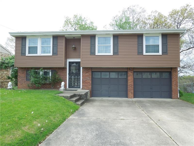 Attractive curb appeal.  Concrete driveway that al