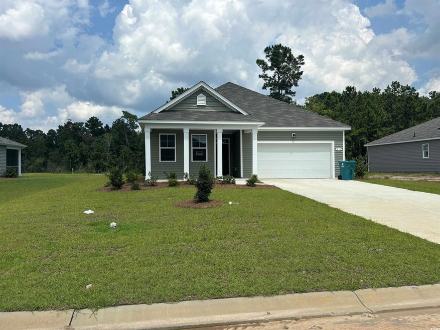 View of front of house featuring a garage and a fr