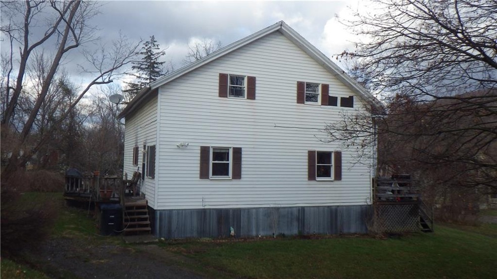 Roadside view of the home. Lower apt enters on the